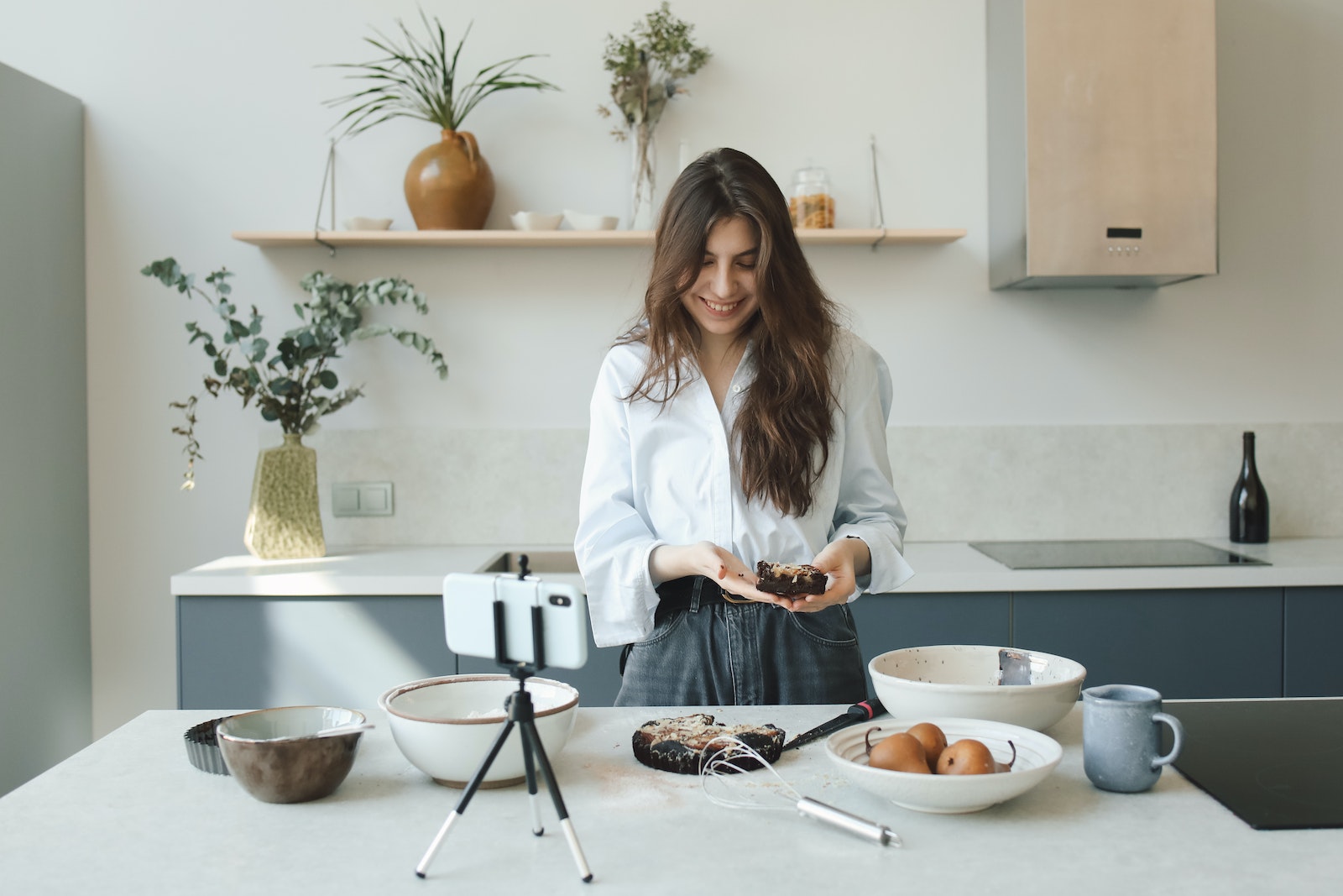 Woman Holding a Chocolate Cake